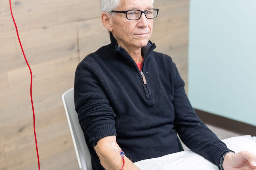 Man sits patiently during Ozone therapy as part of his functional medicine plan for chronic inflammation treatment near Cedar Rapids