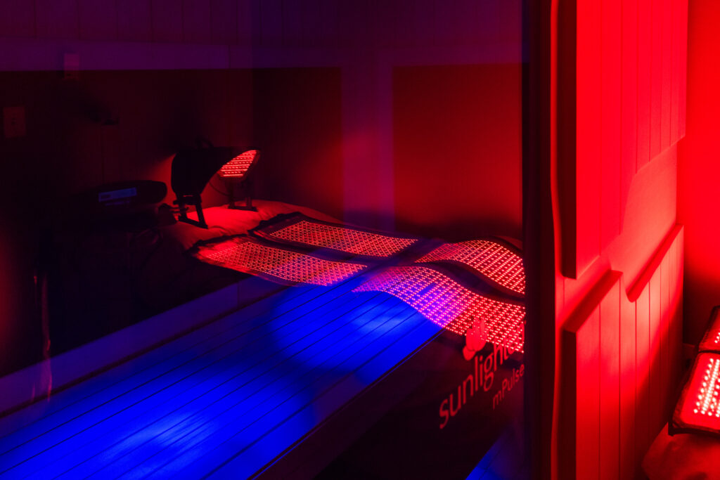 Treatment room an infrared sauna, an anti-inflammatory treatment near Cedar Rapids that delivers heat directly to the body and penetrates deeper tissue to support your immune system. No one is laying in the room, but it is prepped and ready for the next patient.